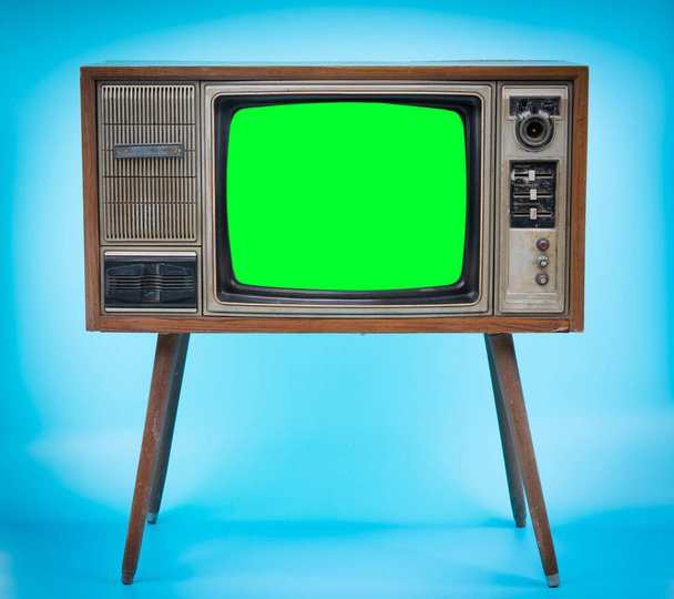 Vintage Retro Style old television with cut out screen, old television on blue background. Television with green screen. - Photo, Image