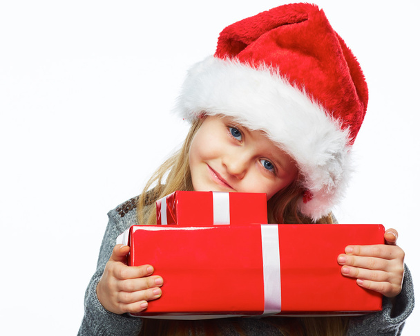 Little girl hold gift box. White background. - Foto, imagen