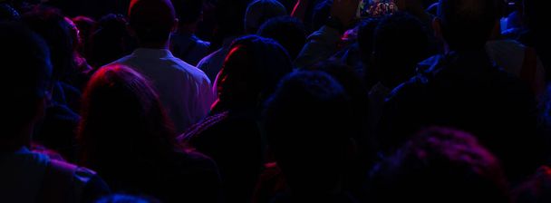 Crowd of people dancing in the night at concert show - Photo, Image