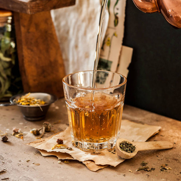 Pouring Herbal Tea into a Glass, Variety of Dried Herb Mixes, square - Φωτογραφία, εικόνα
