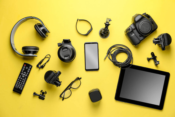 Different modern devices on color background - Photo, Image