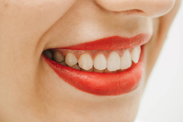 Close-up of a beautiful woman smile. Woman smiling with prefect white teeth - Fotó, kép