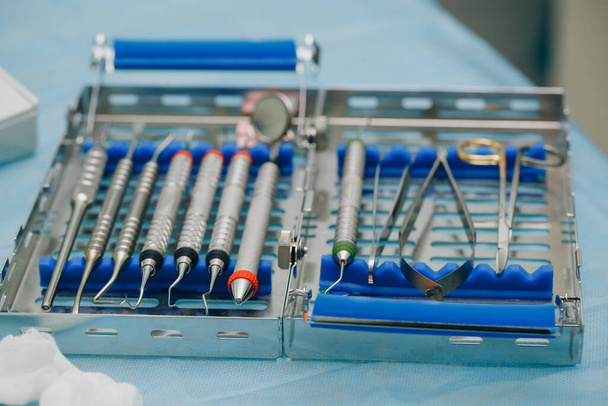 Dentist orthopedist tools. Dental implantation surgical set. Surgical kit of instruments used in dental implantology. - Fotografie, Obrázek
