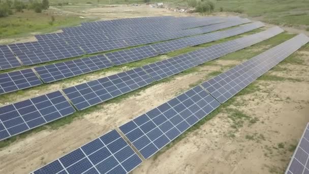 Solar panels aerial view. Shooting from a drone or quadrocopter. Ecological terminal power plant produces electricity. Alternative fuel of the future. Parallel placement of solar silicon cells - Footage, Video