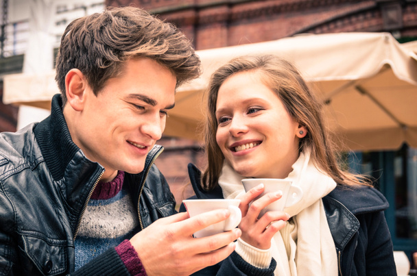 Young Couple lovely enjoying a cup of Coffee - Photo, Image