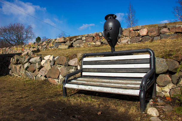 Bench in the form of a sailor inside the stone fortress of Korela in the city of Priozersk. - Photo, Image