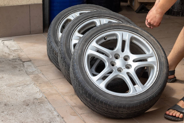 Set of used stylish car wheels with low profile summer tires. Sale of car spare parts - Photo, Image