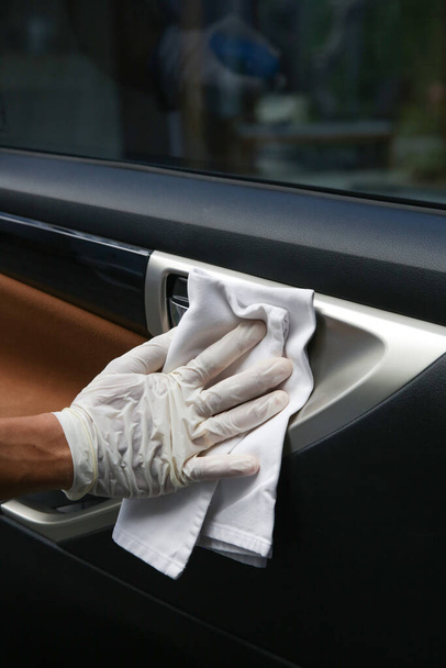 Car Disinfecting. Safety measures for car maintenance during coronavirus. - 写真・画像