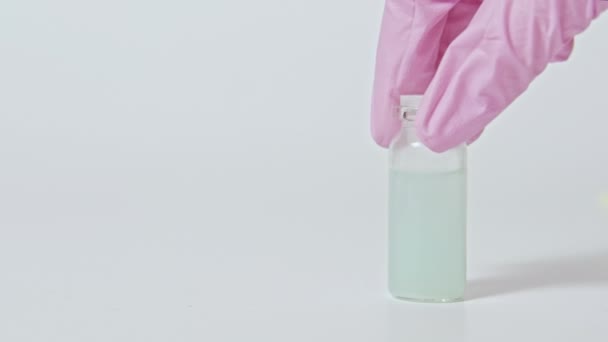 vaccine sample pharmaceutical drug hand bottle - Кадры, видео