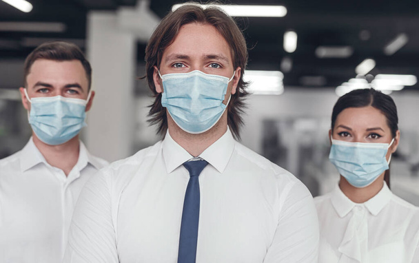 Business team in medical masks - Fotografie, Obrázek