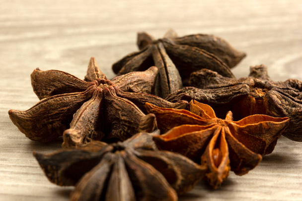Star anise exotic spice on a wooden table - Photo, Image