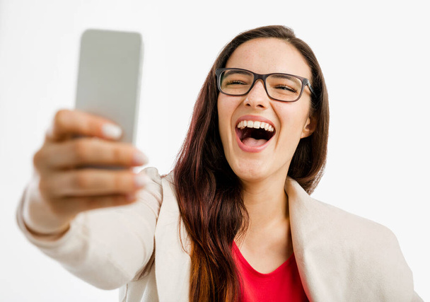 Portrait of a happy woman making a selfie - Fotoğraf, Görsel