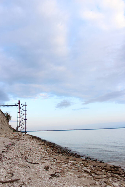 Sea shore. Hill and high stairs to the pier. - Valokuva, kuva