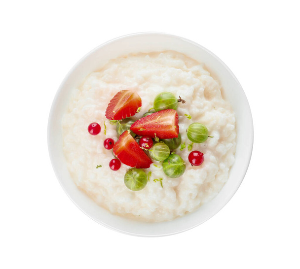 Bowl with boiled rice and berries on white background - Photo, Image