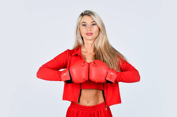 Self improvement. Sporty girl red clothes boxing gloves. Gym and workout. Fitness model. Sporty lifestyle. Sporty woman fitness trainer. Overcome problems. Personal training. Fight with own complex - Zdjęcie, obraz