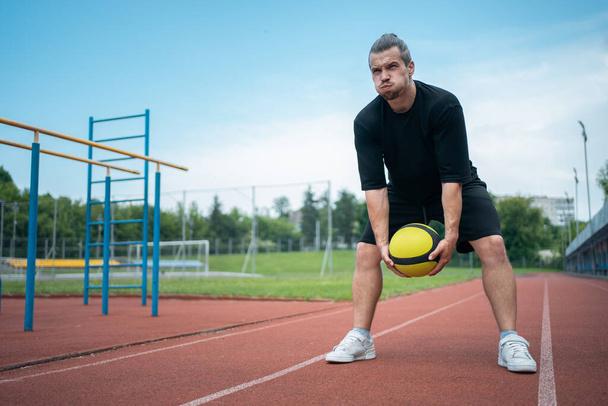 athlete and personal trainer with medicine ball has workout outdoor - Fotoğraf, Görsel