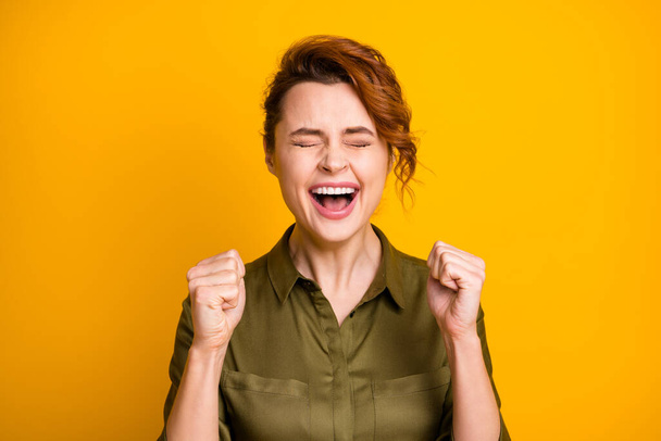 Close-up portrait of her she nice-looking attractive lovely pretty ecstatic overjoyed cheerful cheery girl celebrating having fun isolated over bright vivid shine vibrant yellow color background - Fotoğraf, Görsel