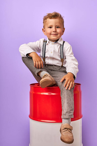 business boy on barrel isolated - Photo, Image