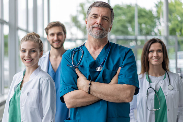 Group of medical staff smiling at the hospital. - Zdjęcie, obraz