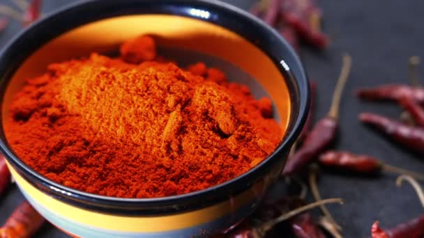 Chili powder and dried peppers on table background. - Footage, Video