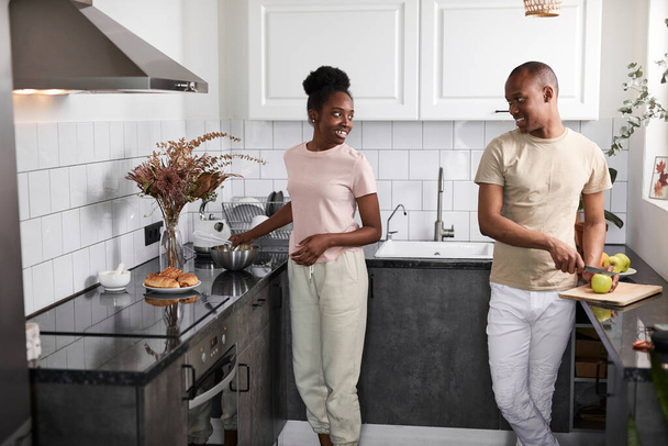 friendly african couple is cooking together in the kitchen - 写真・画像