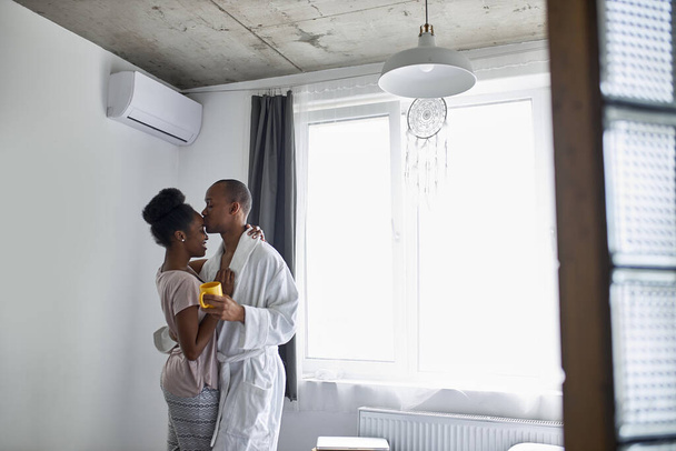 african married couple in chime in the morning at home - Fotó, kép