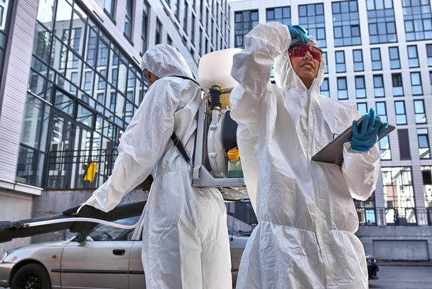portrait of workers in hazmat suits. time to protect yourself, stay at home - Фото, зображення