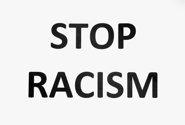 Text STOP RACISM on paper - Foto, Imagen