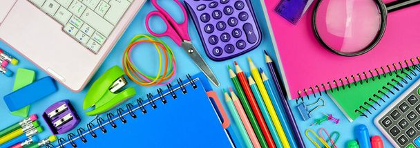 School supplies banner. Top down scene over a blue paper background. Back to school concept. - Photo, Image