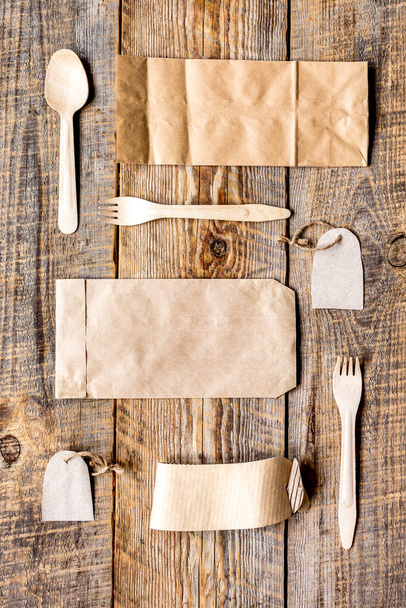 food delivery workdesk with paper bags and flatware table background top view mock-up - Foto, afbeelding