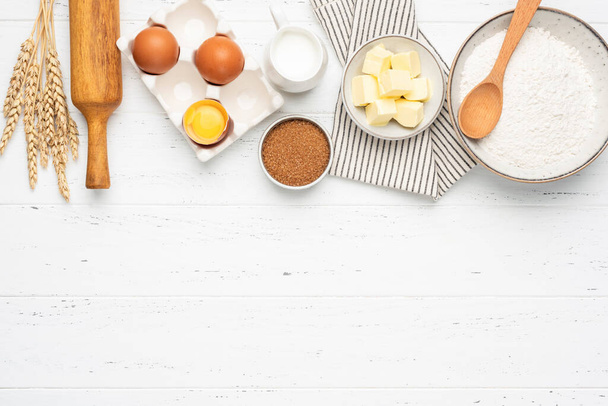 Ingredients for baking on white wooden table background - Foto, imagen