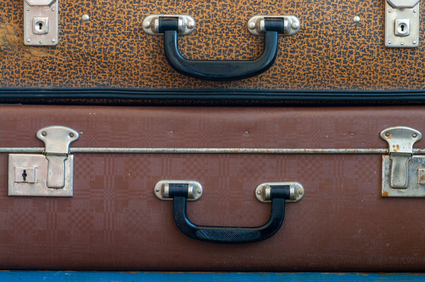 Two old suitcases on top of each other. Close up - Foto, afbeelding