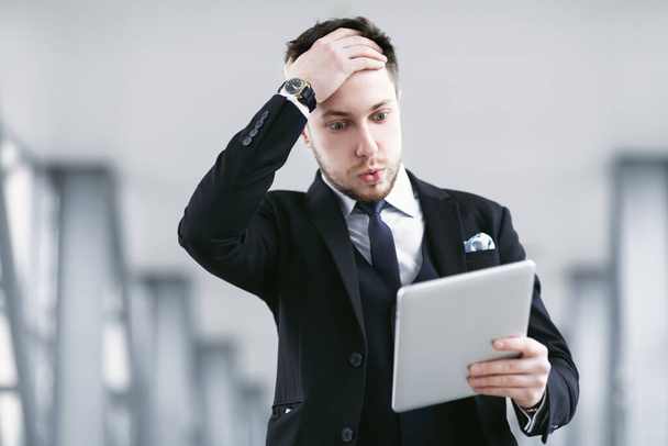 Sad adult business man using digital tablet - Photo, Image