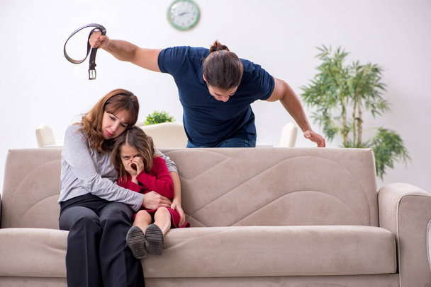 Young couple and their daughter in family conflict concept - Fotoğraf, Görsel