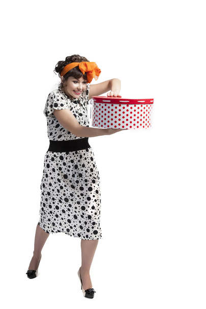 Happy girl opening gift box with red polka dots - Foto, immagini
