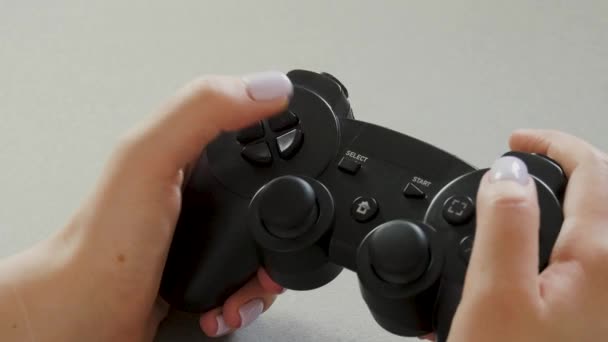 Close up shot of woman hand with console gamepad at home. Gaming, hobby concept - Footage, Video