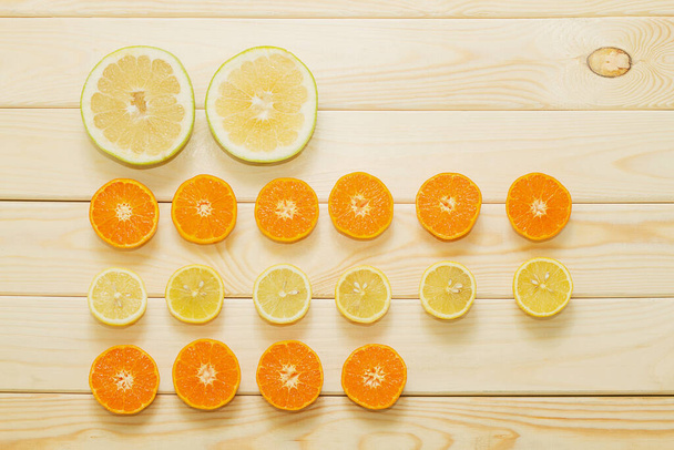Orange slices on wooden board - Fotoğraf, Görsel