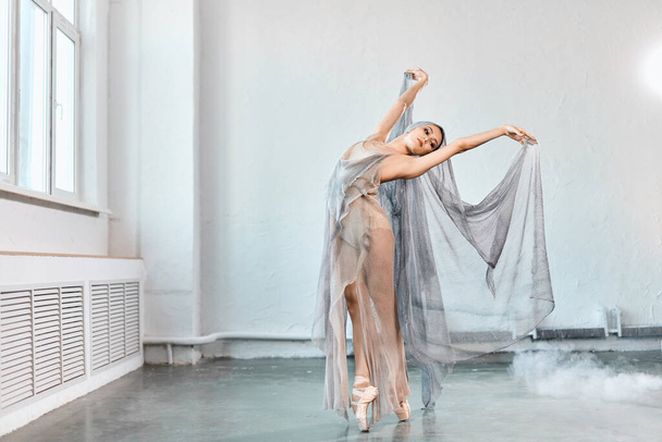 Female ballet dancer with white flowing fabric. Flow shapes and movement. - Fotó, kép
