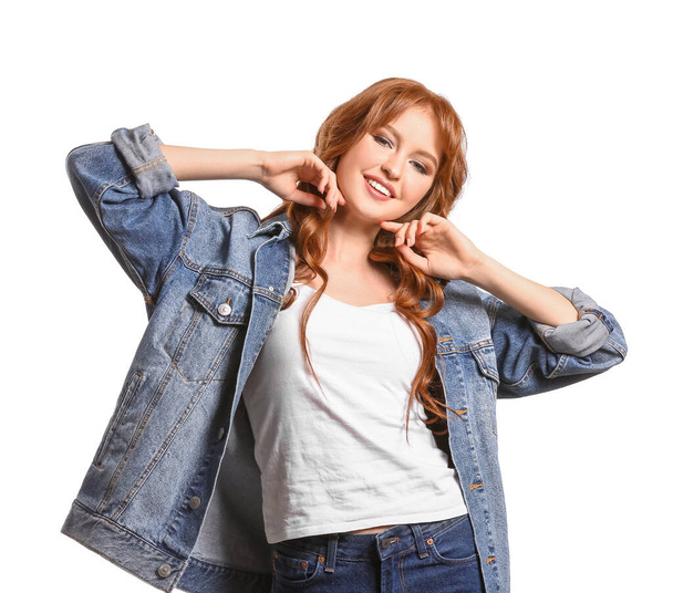 Beautiful young redhead woman on white background - Foto, afbeelding