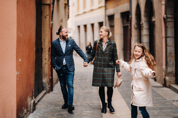 A beautiful family with strolls through the old city of Lyon in France.Family trip to the old cities of France. - Fotó, kép