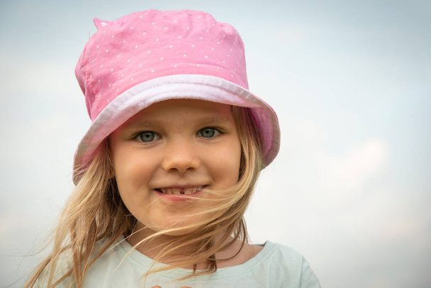 Girl child portrait. Little kid smiling face. Happy adorable and pretty young female head. Joy and happiness expression of caucasian child.  close-up of smile preschooler happy child with blond hair. - Photo, Image