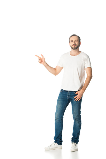 full length view of man pointing with finger aside isolated on white - Foto, immagini