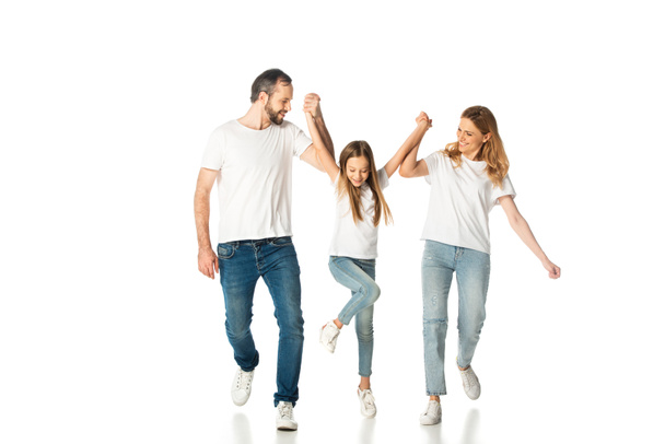 happy casual family holding hands while walking isolated on white - Φωτογραφία, εικόνα
