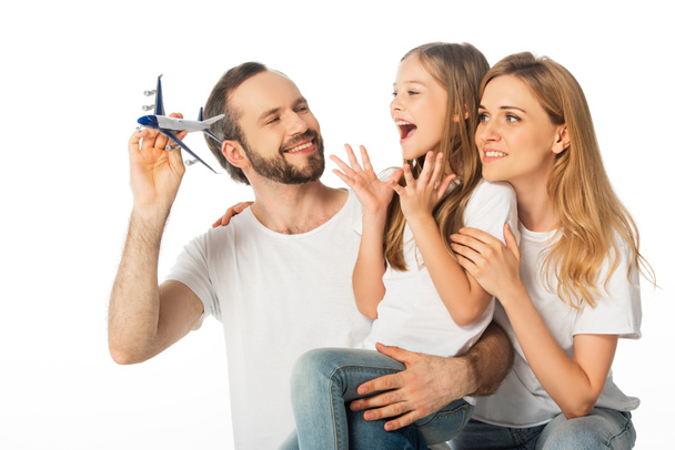 happy smiling family with plane model isolated on white - Foto, Imagen