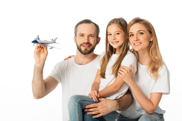happy smiling family with plane model isolated on white - Фото, зображення