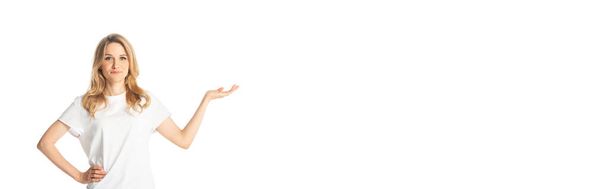 attractive adult woman pointing with hand aside isolated on white, panoramic shot - Foto, imagen