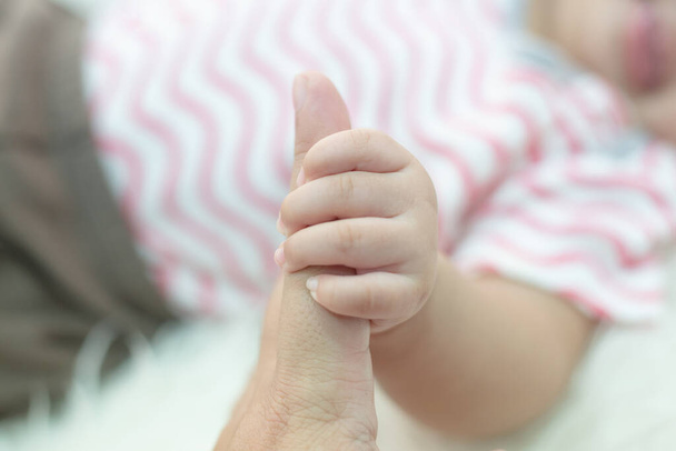 New born baby hand,selective focus - Фото, изображение
