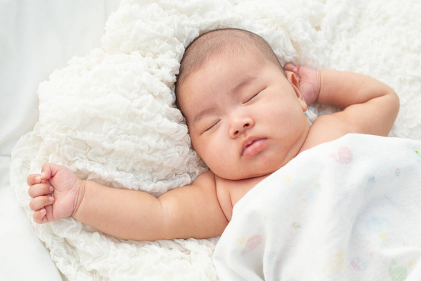 Baby lying on the bed - Photo, Image