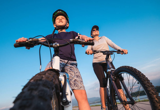 Mother with son ready for bicycle ride - Photo, image