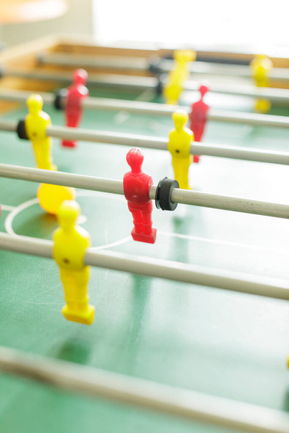 Close up of table football. Red and yellow table soccer players. High resulotion image. - Фото, изображение